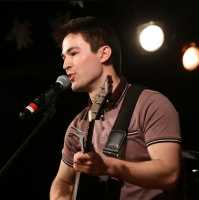 Ryan Heath singing at recital  - Slide 0 of 3